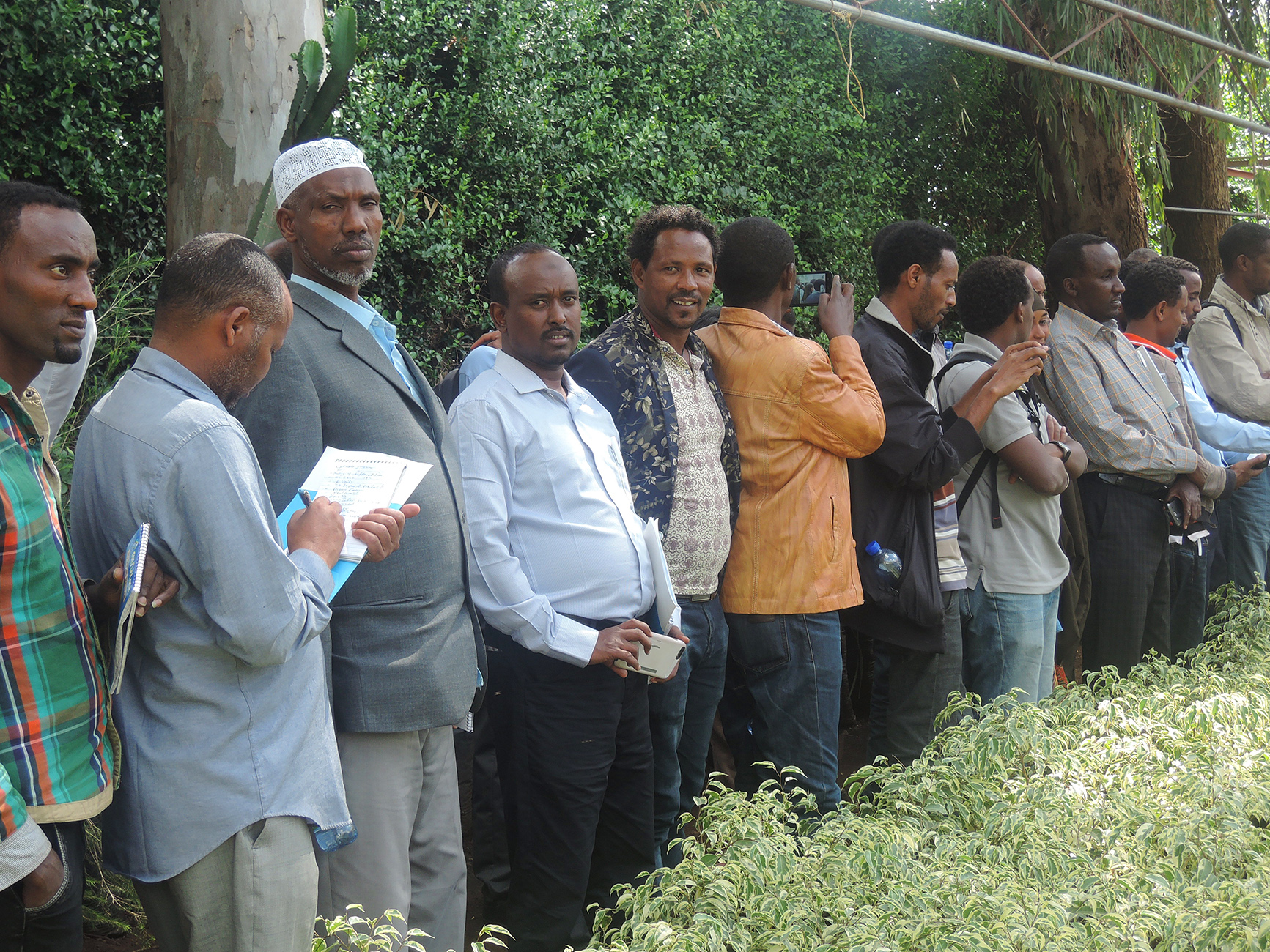 TMT_LED Ethiopia_2015_SV_participants listening_men_Africa copy