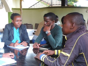TMT_ACCU Uganda_2016_CR_outside_group work_women_men_Africa copy