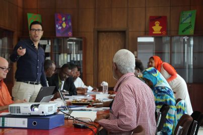 TMT_EVC_Sudan_2017_CR_pariticpants listening_men_women_Africa