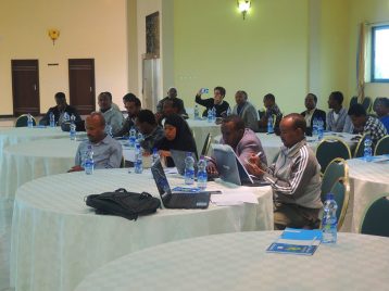 TMT_LED Ethiopia_2015_CR_participants listening_men_women_Africa copy