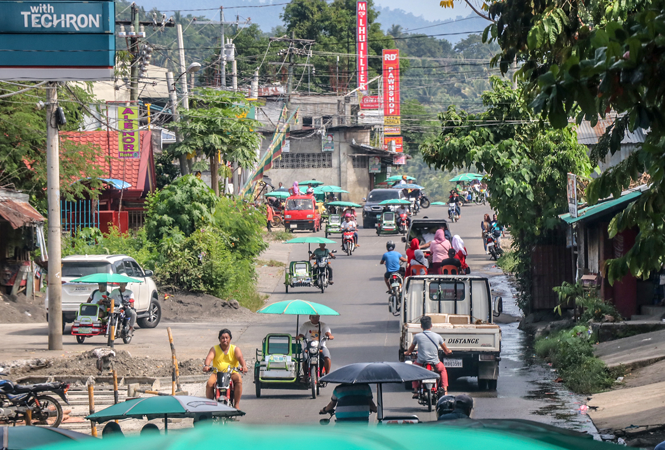 COTABATO, PHILIPPINES – AUGUST 19: A view of a peaceful street i COTABATO, PHILIPPINES – AUGUST 19: A view of a peaceful street i